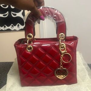 Mini tote quilted square handkerchief bag with crossbody shoulder.